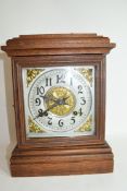 Early 20th century mantel clock, pressed metal dial to a brass movement striking on a coiled gong