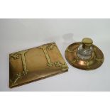 Victorian brass ink stand with clear glass bottle decorated with Gothic hinged type detail, together