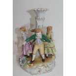 Continental porcelain candlestick in Meissen style decorated with children dancing around a