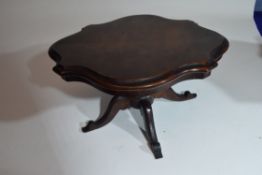 An apprentice piece, a miniature walnut veneered Victorian loo table set on turned column with