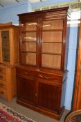Full height mahogany side cabinet with glazed bookcase raised over double cupboard, width approx