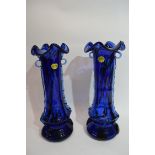 Pair of blue glass vases with trailing design in relief to either side, bearing label "Murano Italy"