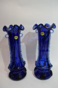 Pair of blue glass vases with trailing design in relief to either side, bearing label "Murano Italy"