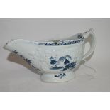 Large Lowestoft sauce boat circa 1765, the body crisply moulded with trailing flowers, bordering a