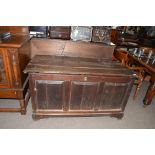 Large oak coffer with three panelled front and plank top, 135cm wide