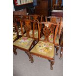 Set of 5 Chippendale style mahogany dining chairs, elaborate pierced splat backs, old tapestry