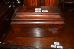 Georgian mahogany sarcophagus formed tea caddy, the hinged lid opening to an interior with two