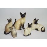 Group of ceramic models of cats by Beswick and others, mainly Siamese (qty)