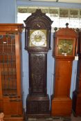 Ornately carved longcase clock, with gilt dial mounted with Roman chapter ring, subsidiary minutes