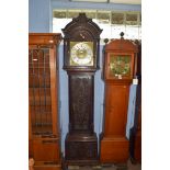 Ornately carved longcase clock, with gilt dial mounted with Roman chapter ring, subsidiary minutes