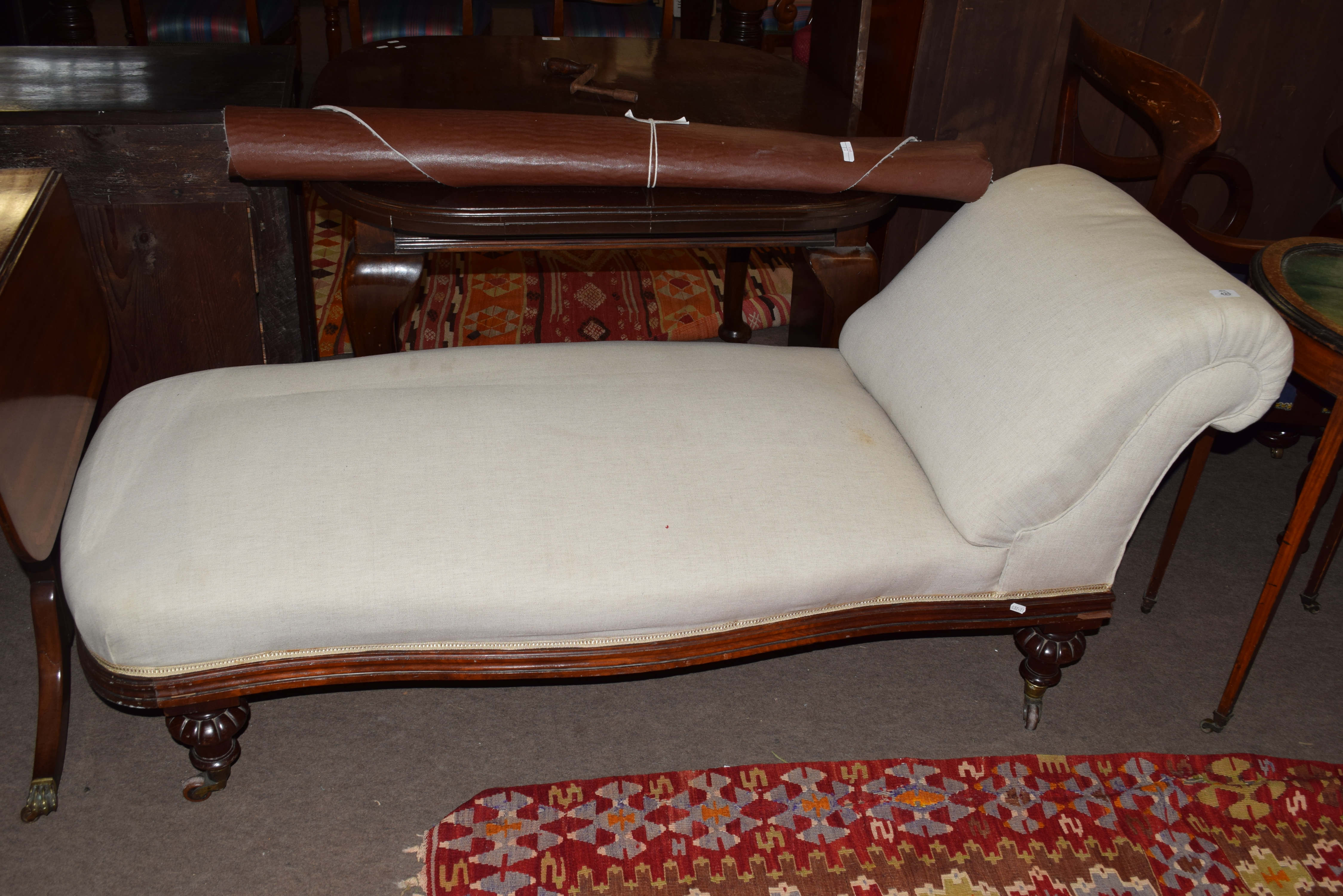 Victorian chaise longue, mahogany frame raised on short carved legs with casters, approx 160cm long