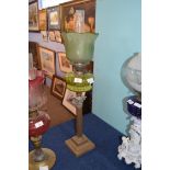 Victorian oil lamp with frosted green glass shade with floral decoration, clear glass chimney, green