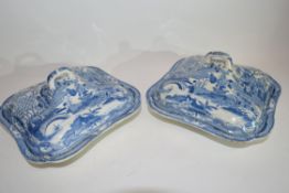 Pair of English pottery flow blue vegetable tureens with printed pattern of Gothic castles, possibly