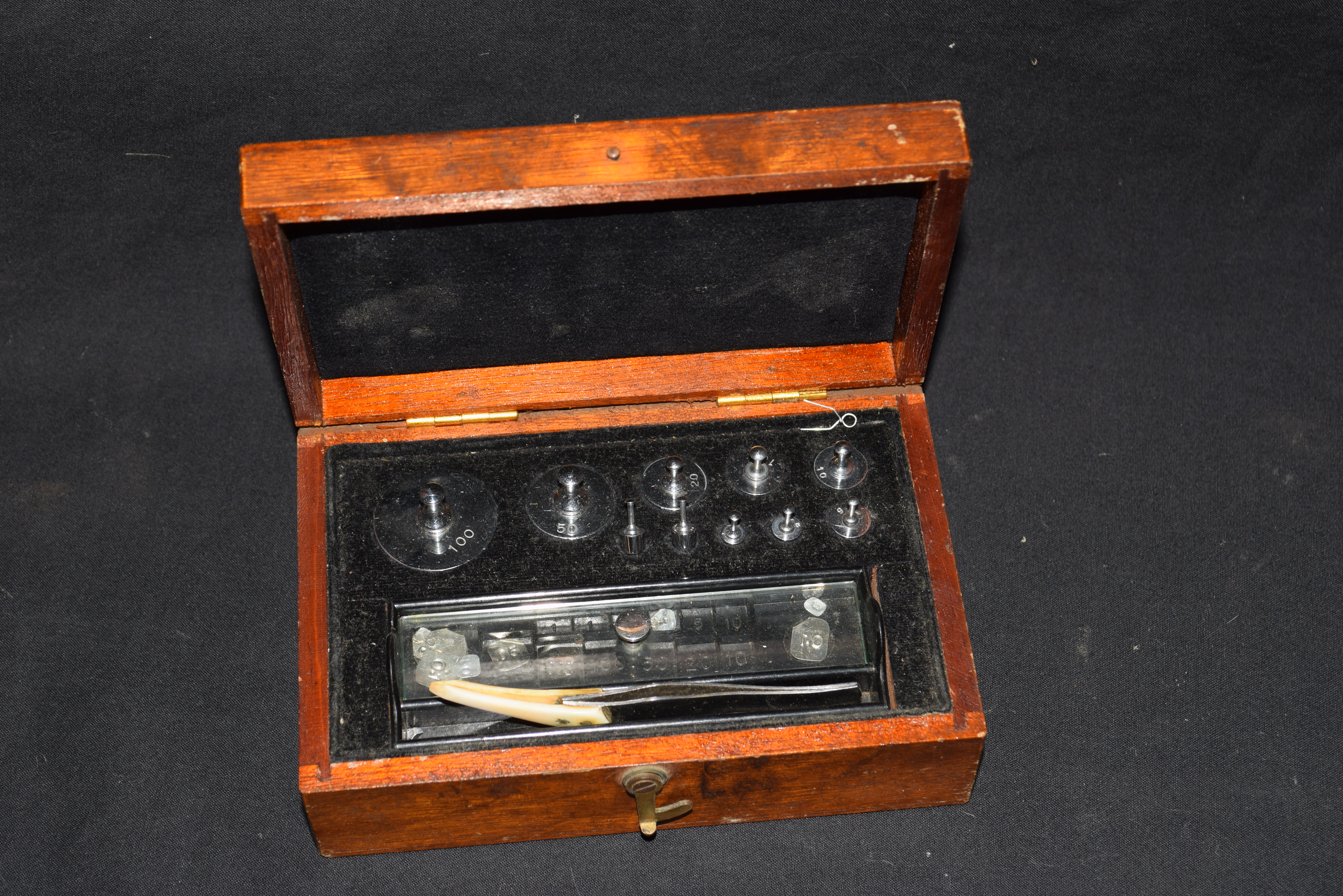 Cased set of chemists weights, the box bearing trade label for J Towers & Co Ltd, Manchester, Widnes