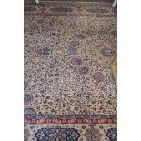 Wool carpet, beige coloured ground, blue and foliate pattern, gulled border, 12 x 9ft