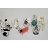 Collection of glass animal sculptures including a dog paperweight, a faceted glass duck and a