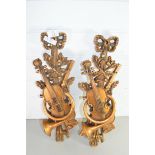 TWO MODERN GILT WOOD ORNAMENTS FORMED AS VIOLINS AND HORNS