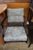 EARLY 20TH CENTURY OAK FRAMED LOW ARMCHAIR WITH FLORAL UPHOLSTERY, 65CM HIGH