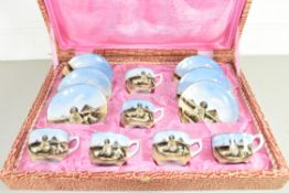 CASED PORCELAIN SET OF COFFEE CUPS AND SAUCERS DECORATED WITH EGYPTIAN PYRAMID SCENES