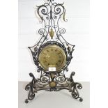 20TH CENTURY MANTEL CLOCK IN ELABORATE IRON FRAMED SURROUND