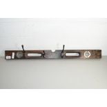 COAT RACK FORMED FROM A SPIRIT LEVEL