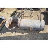 Galvanised tub along with another galvanised water storage barrel