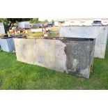 Very large galvanised water tank with riveted construction, approx 304cm long