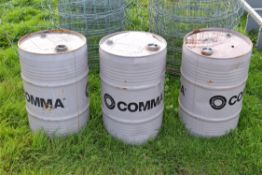 Three Comma oil barrels (empty)