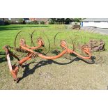 Tractor mounted hay rake