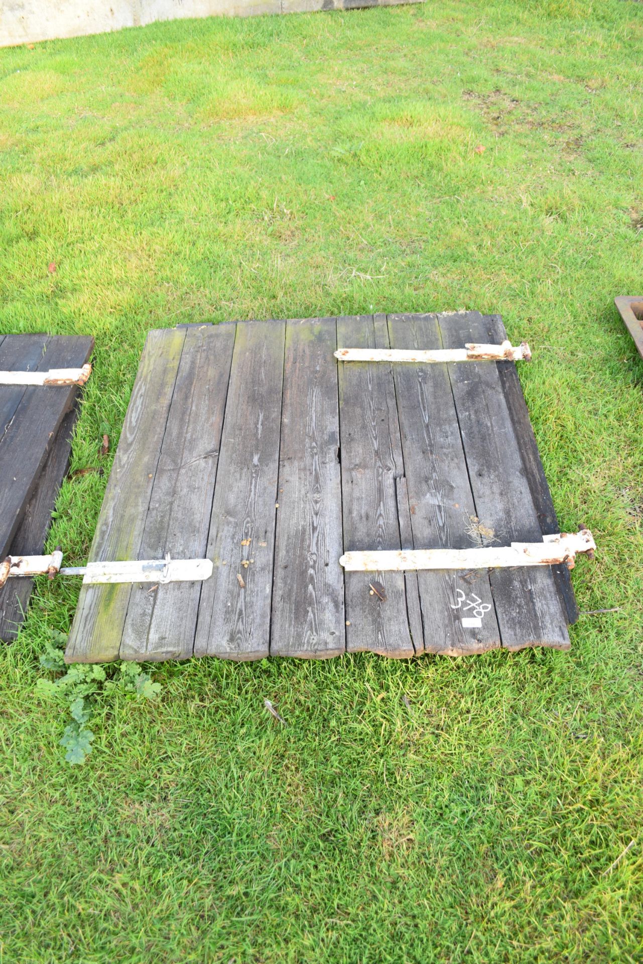 Wooden stable doors with iron hinges