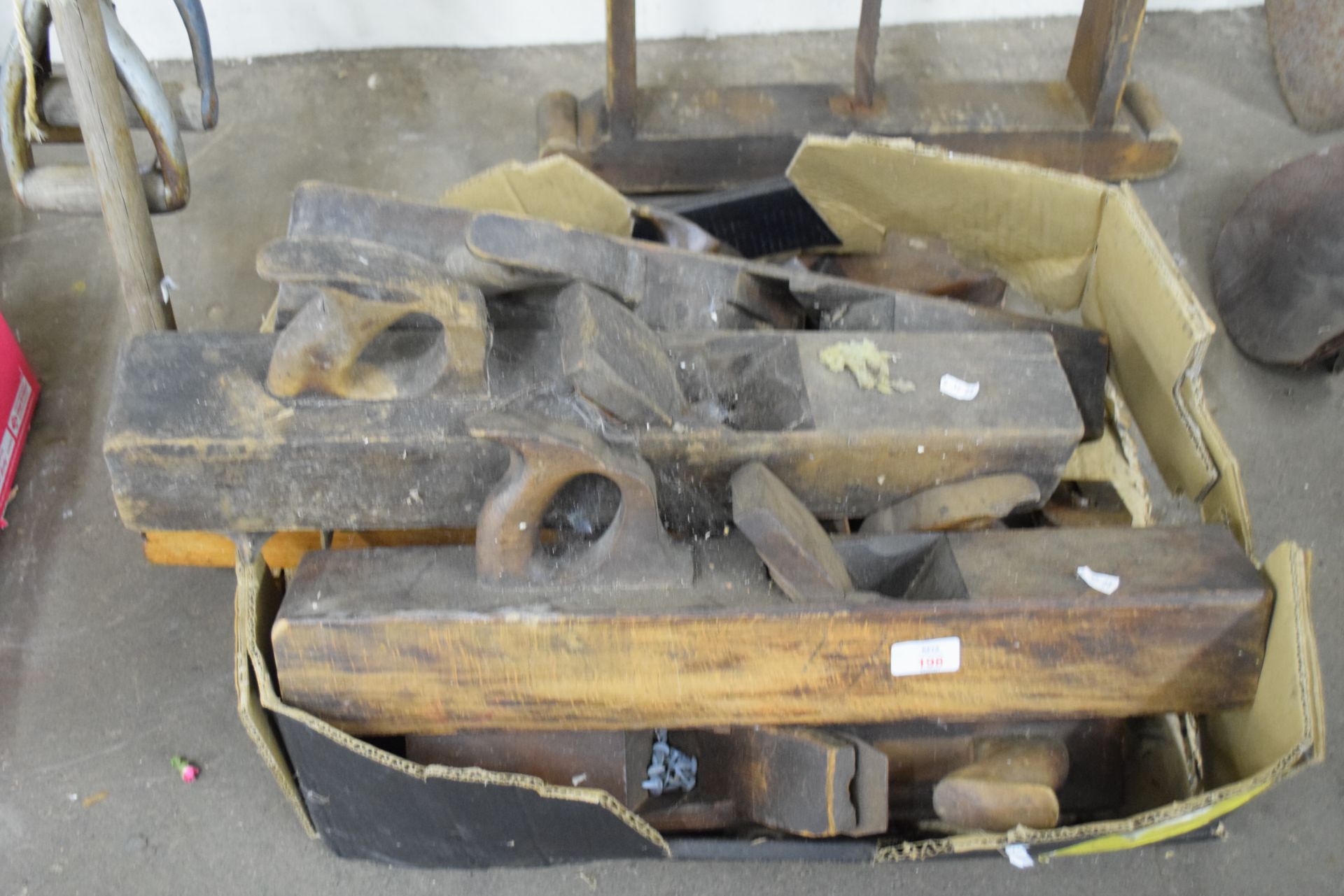 Box containing large wooden block planes