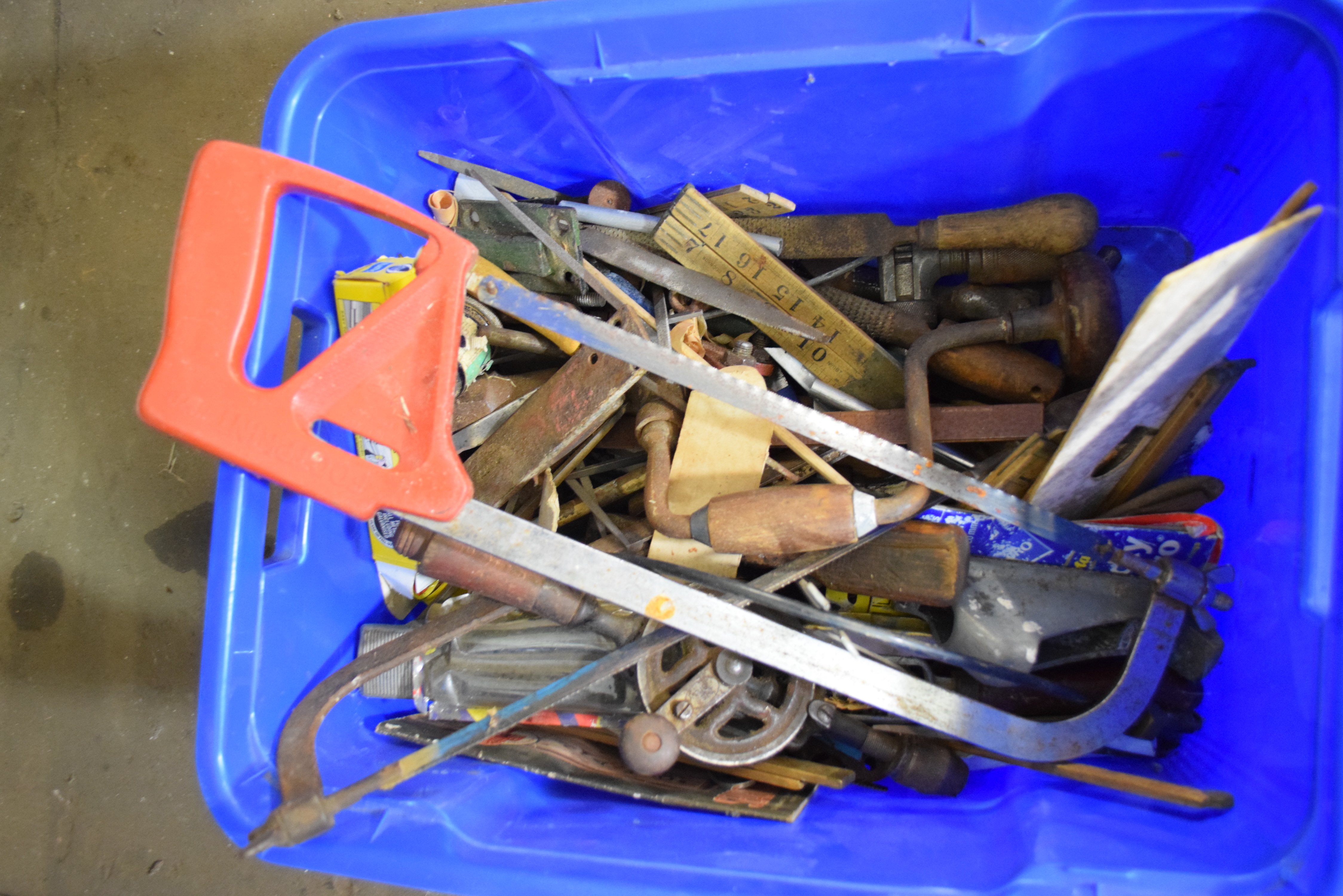 Box containing vintage tools