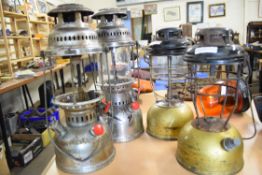 Four paraffin lamps