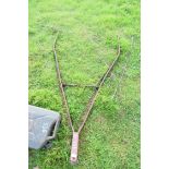 Cast iron draw bar for an agricultural implement