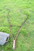 Cast iron draw bar for an agricultural implement