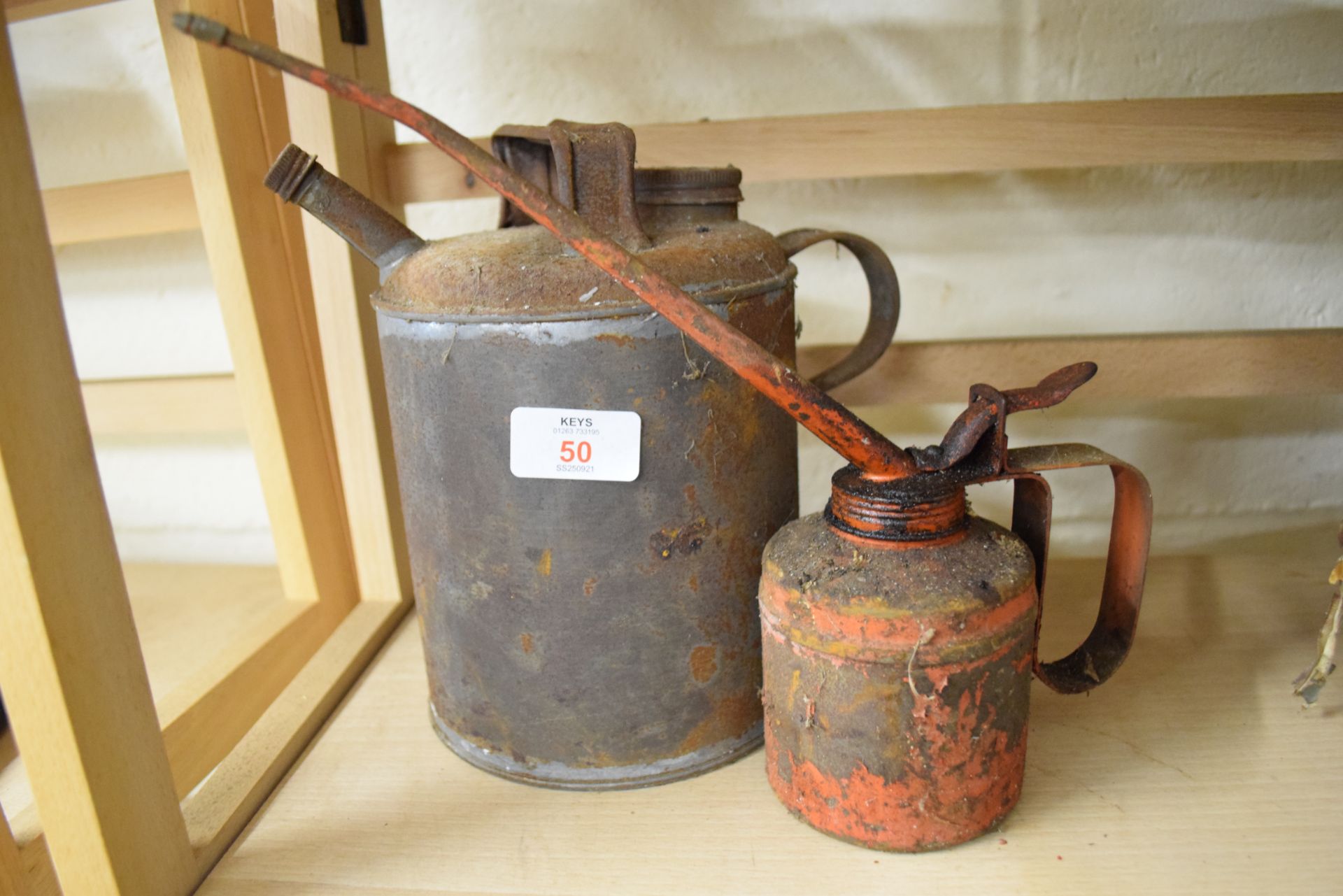 Two vintage oil cans