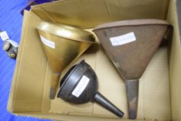 Three boxed metal funnels, one brass