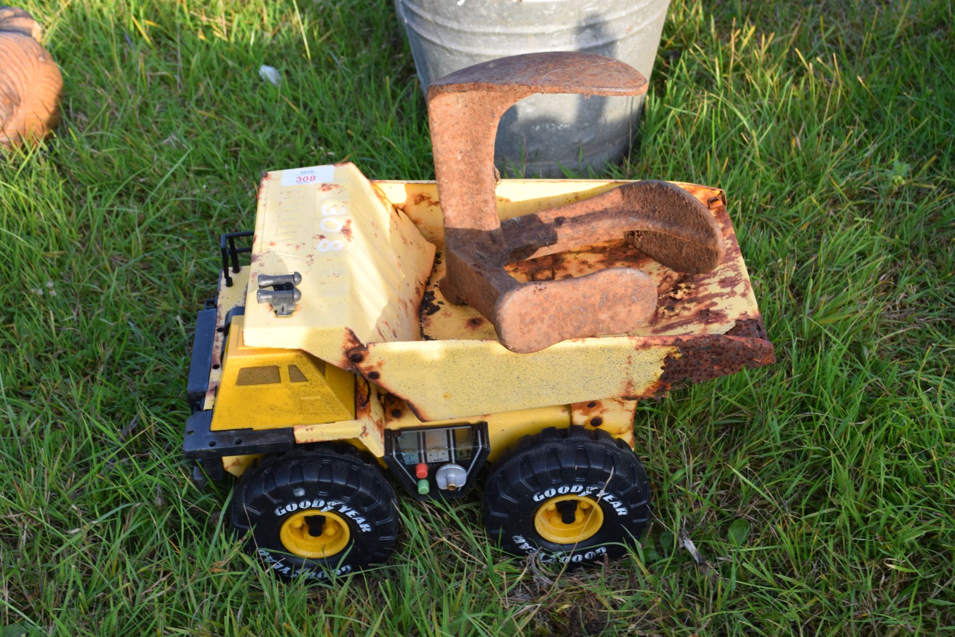 Vintage toy truck and an iron shoemaker's last