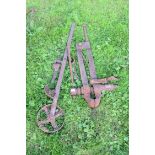 Mixed lot of large vintage iron vice, pickaxe heads and other items