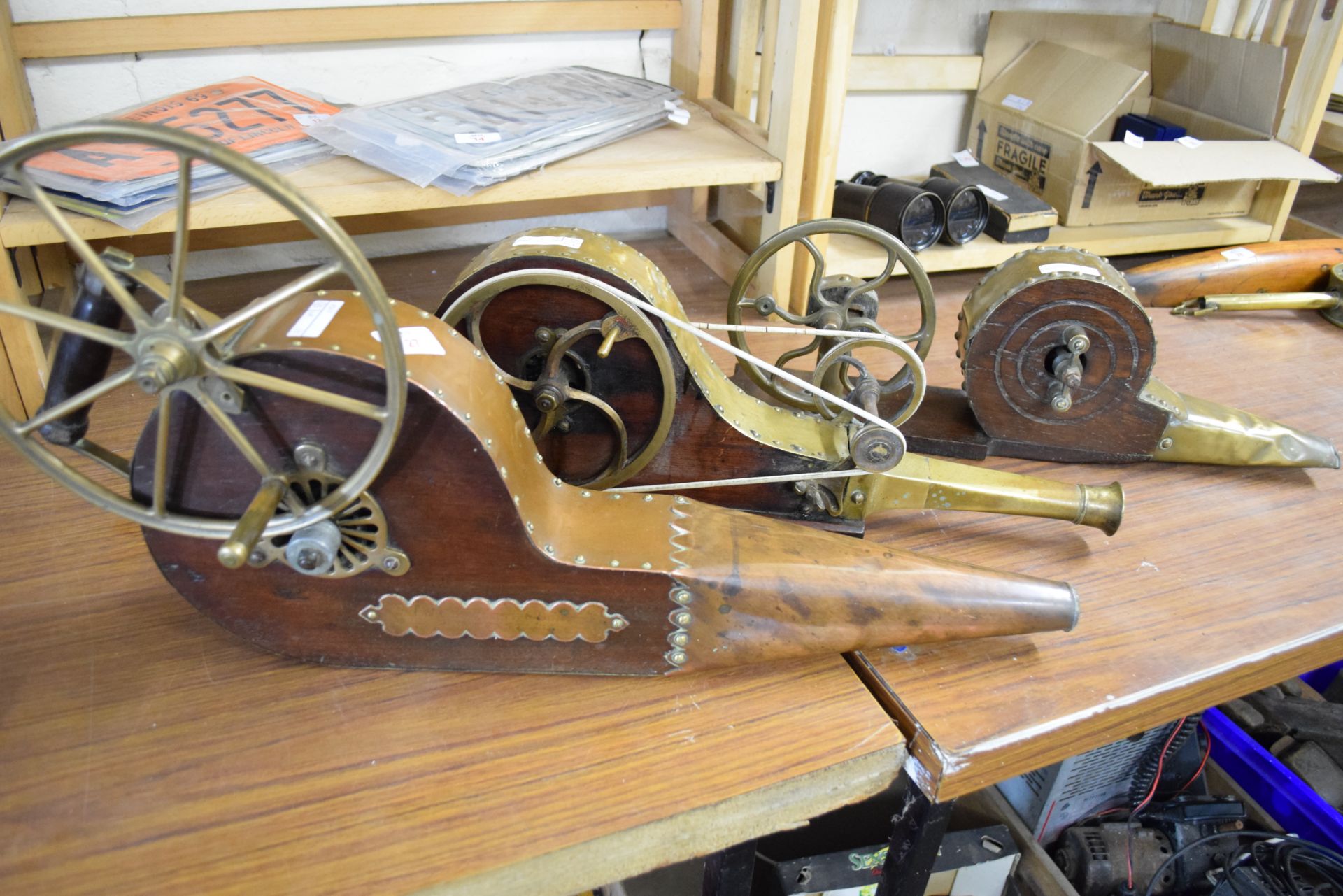 Collection of three 19th century brass or copper mounted mechanical fire bellows, bearing makers