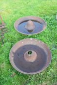 Two cast iron Mexican hat type pig feeders