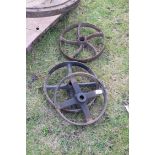 Three vintage implement wheels, largest approx 32cm diam