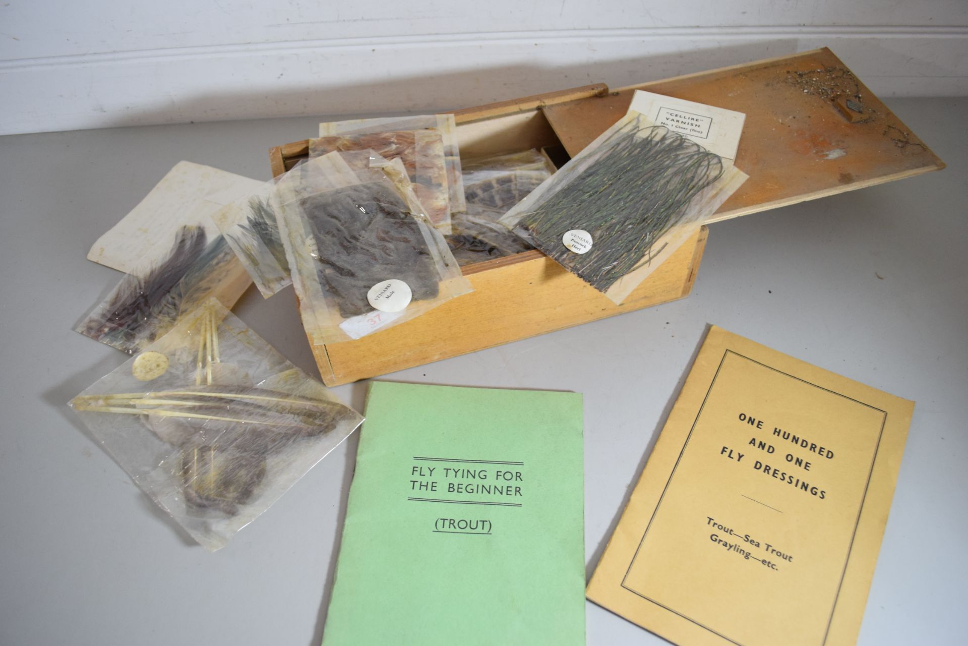 Box containing 'Fly Tying for the Beginner' instruction booklet and '101 fly dressings', along