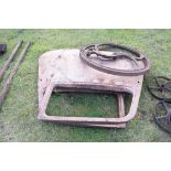 Pair of vintage car doors together with a large iron implement wheel