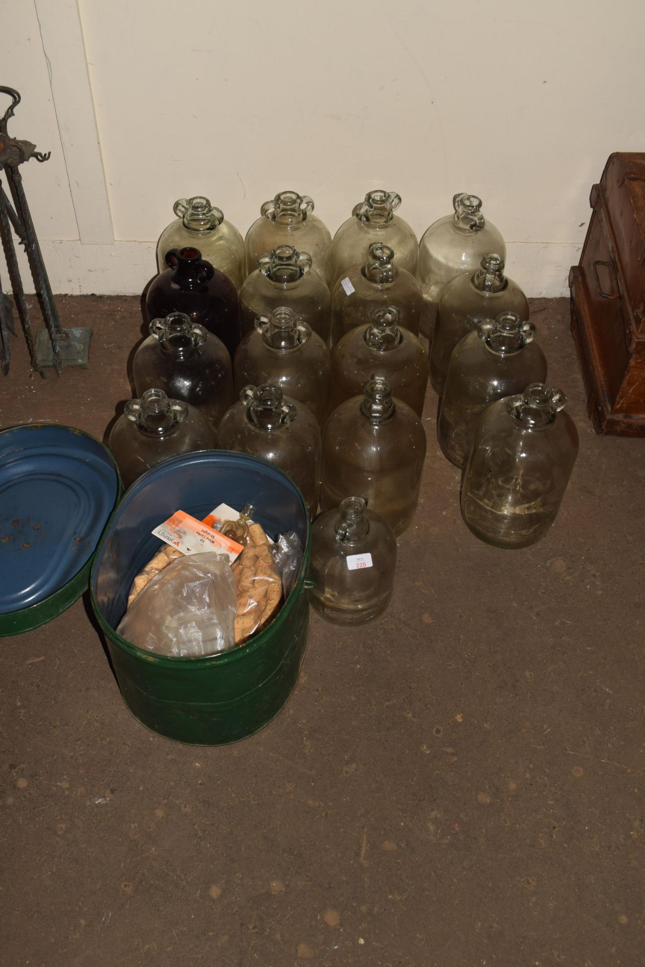 Quantity of glass carboys to include tin hat box with bottle stops