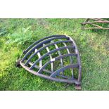 Two iron corner hay racks, largest approx 70cm high