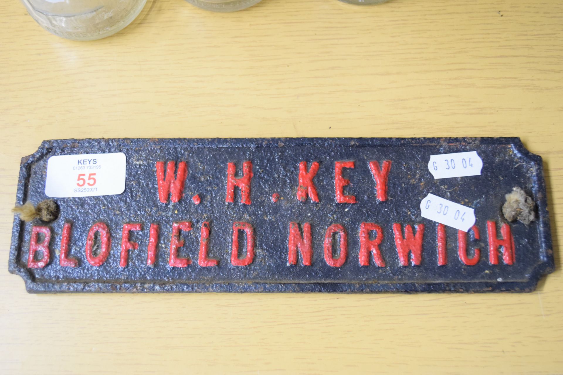 Small iron plaque for W H Key, Blofield, Norwich