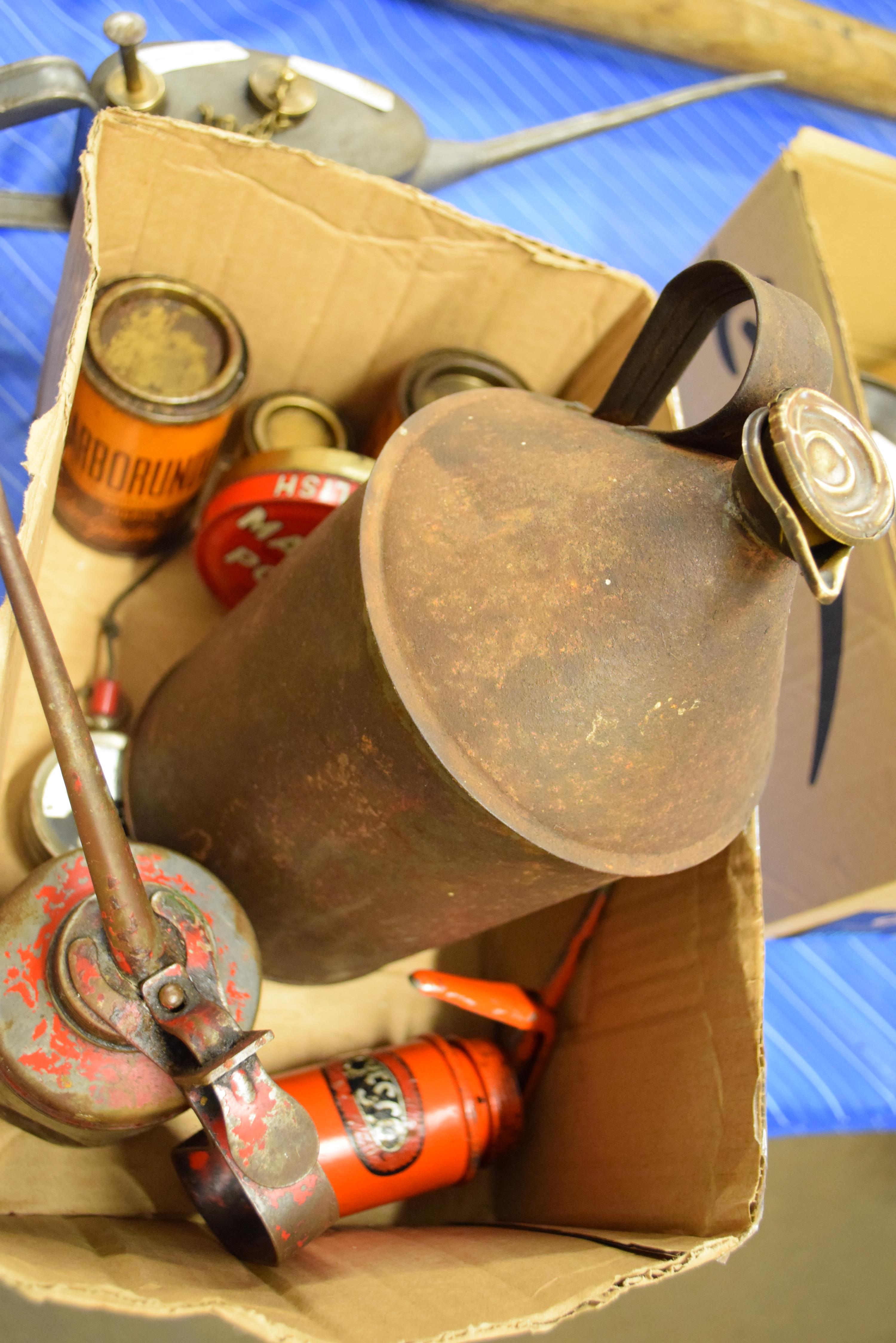 Box containing three oil cans, vintage voltmeter