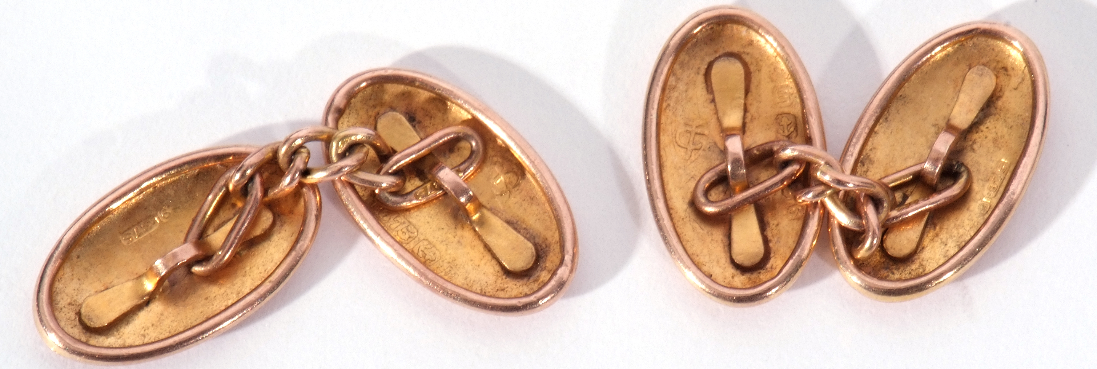 Pair of 9ct gold cuff links, the oval engraved panels chased and engraved with foliate and - Image 2 of 2