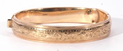 9ct gold hollow hinged bracelet, part engraved, (dented), Birmingham 1960, g/w 13.5gms